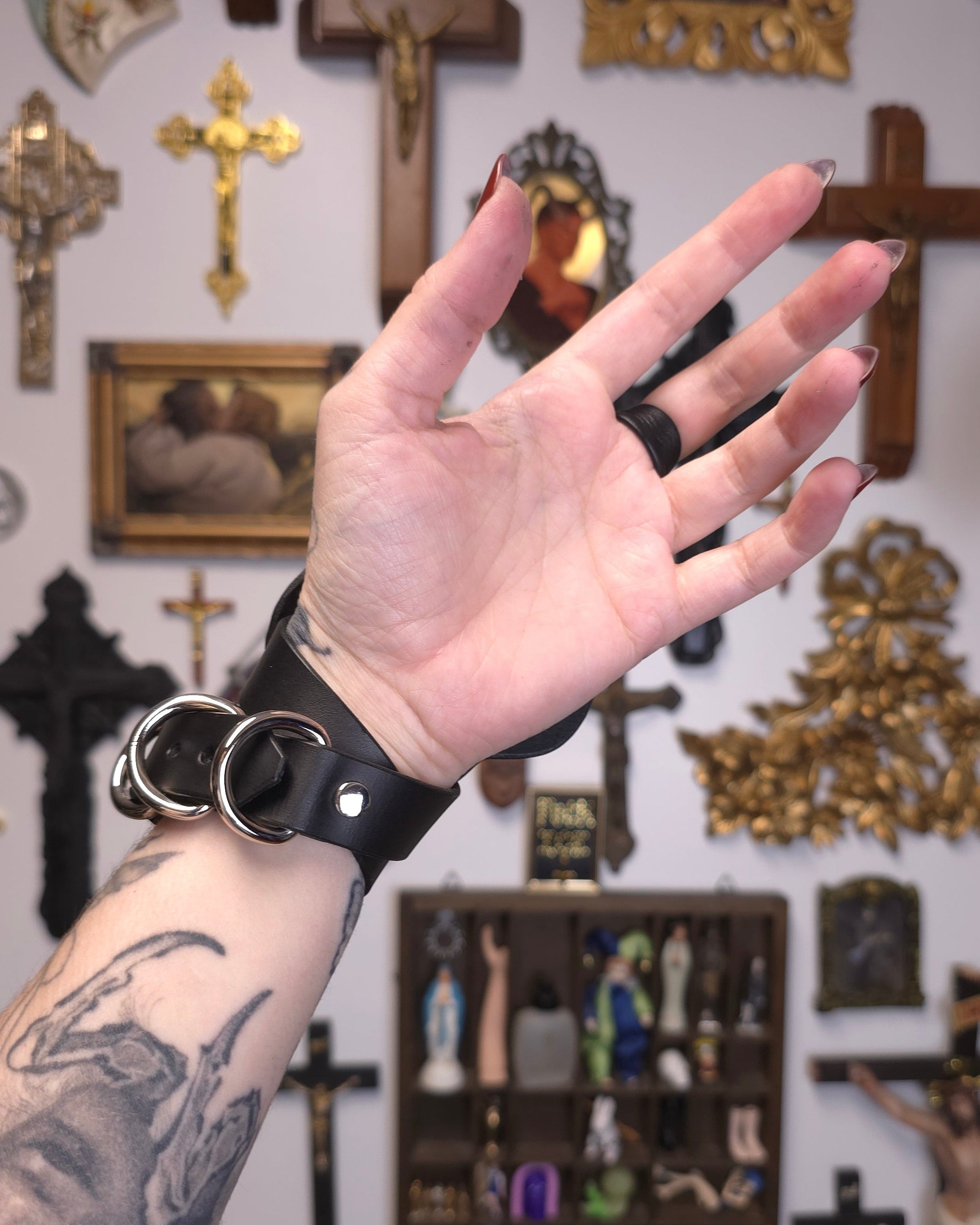 palm of hand with black leather band