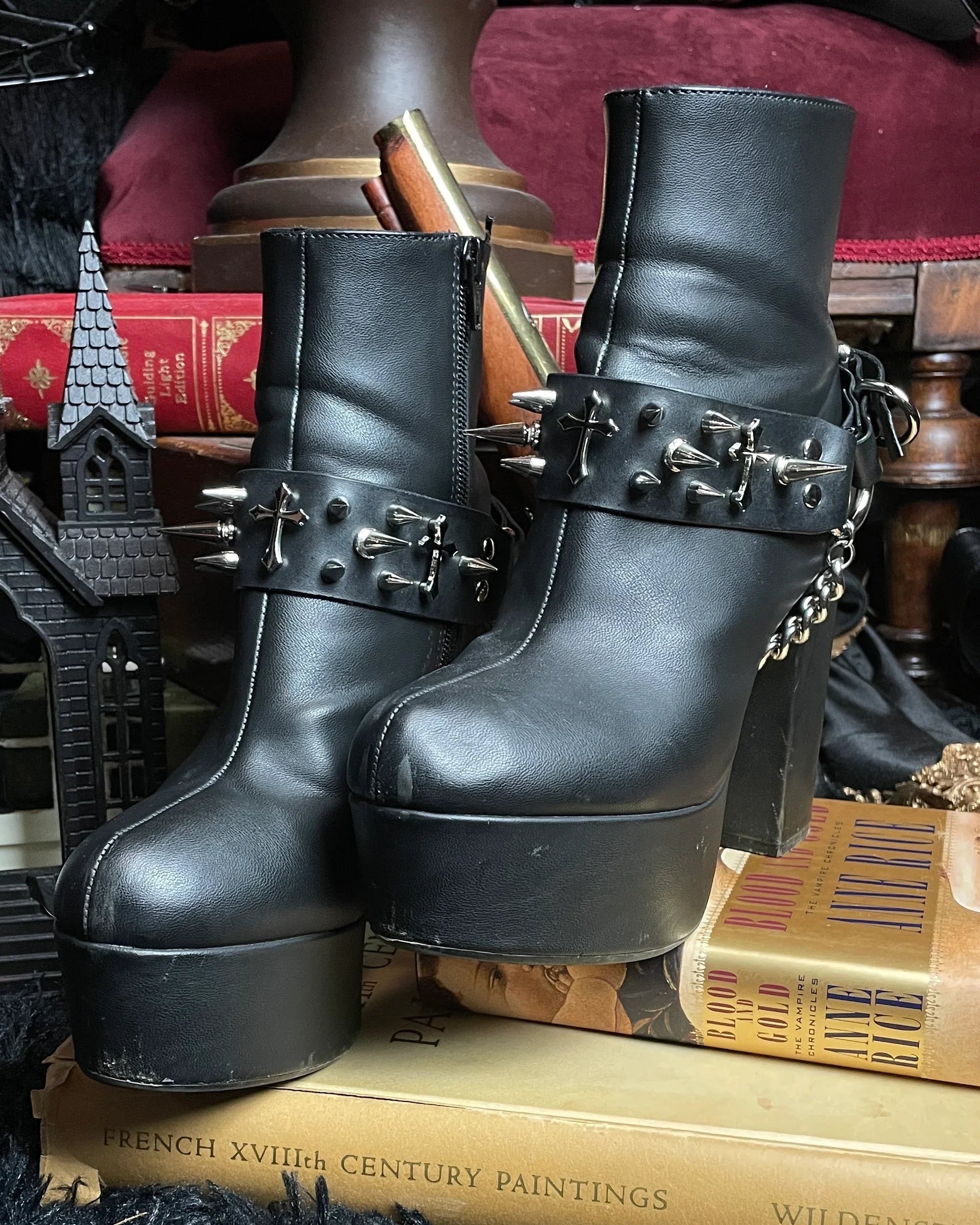 Black platform boots with metal buckles and spikes 