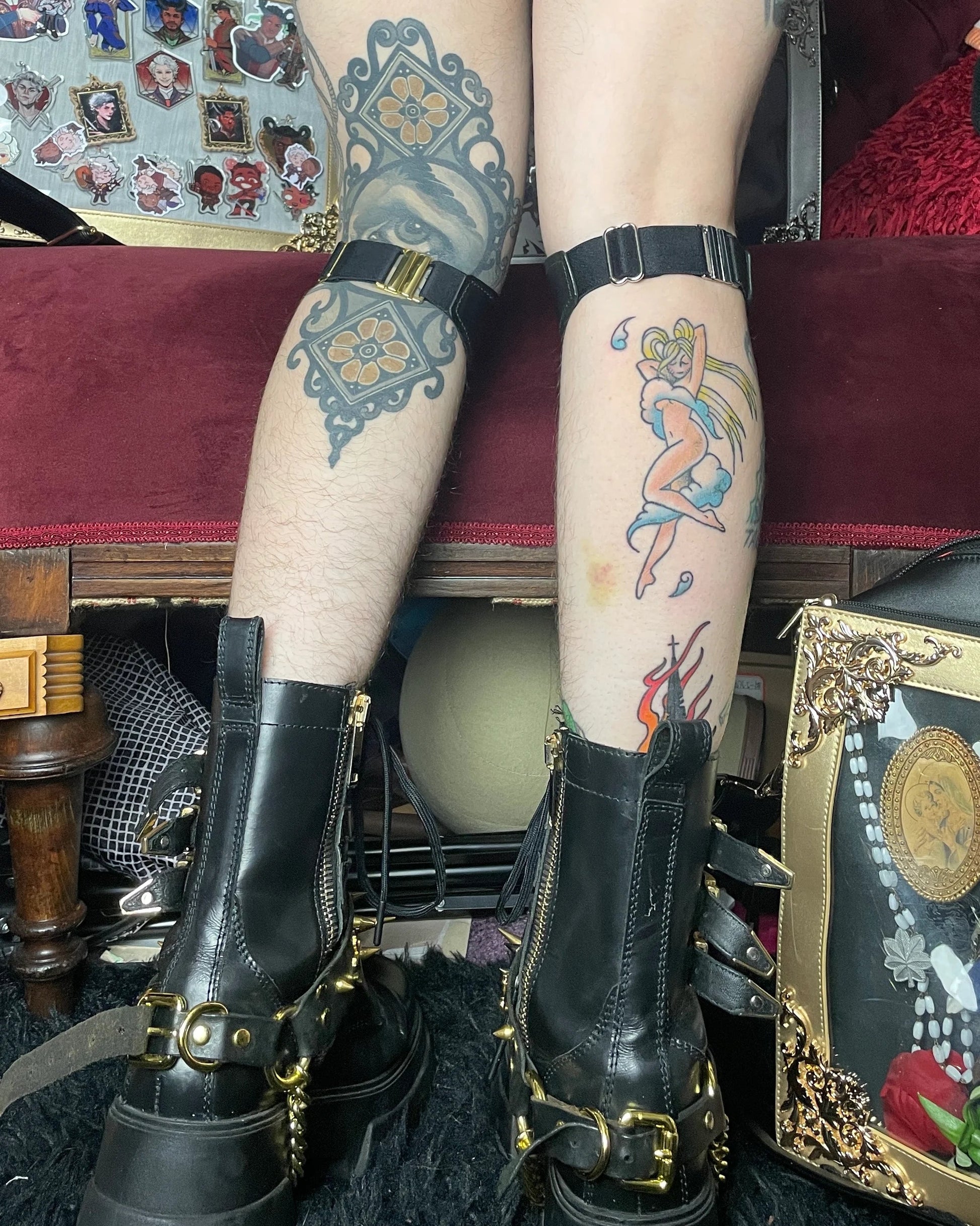 back view of lower legs, person wearing black boots and elastic strap on calf.