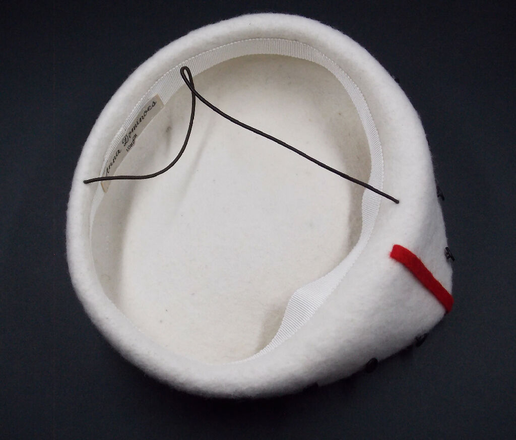 80s inspired white pointed hat with black and red detail