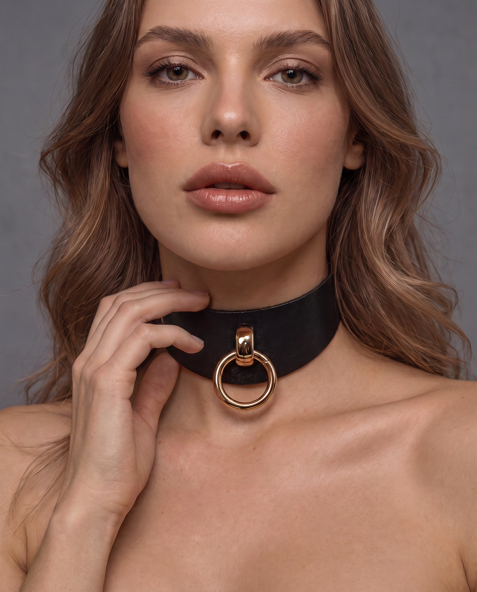 woman wearing a black leather choker collar with O-ring at the front