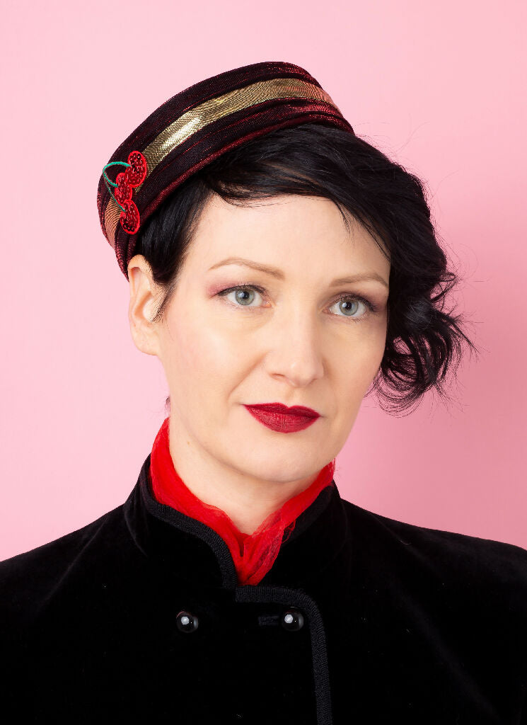 Red and gold bellhop hat