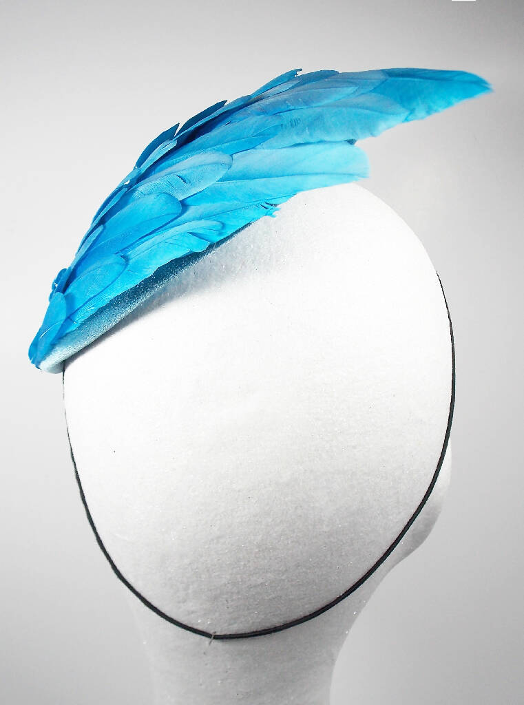 Turquoise feather wing fascinator