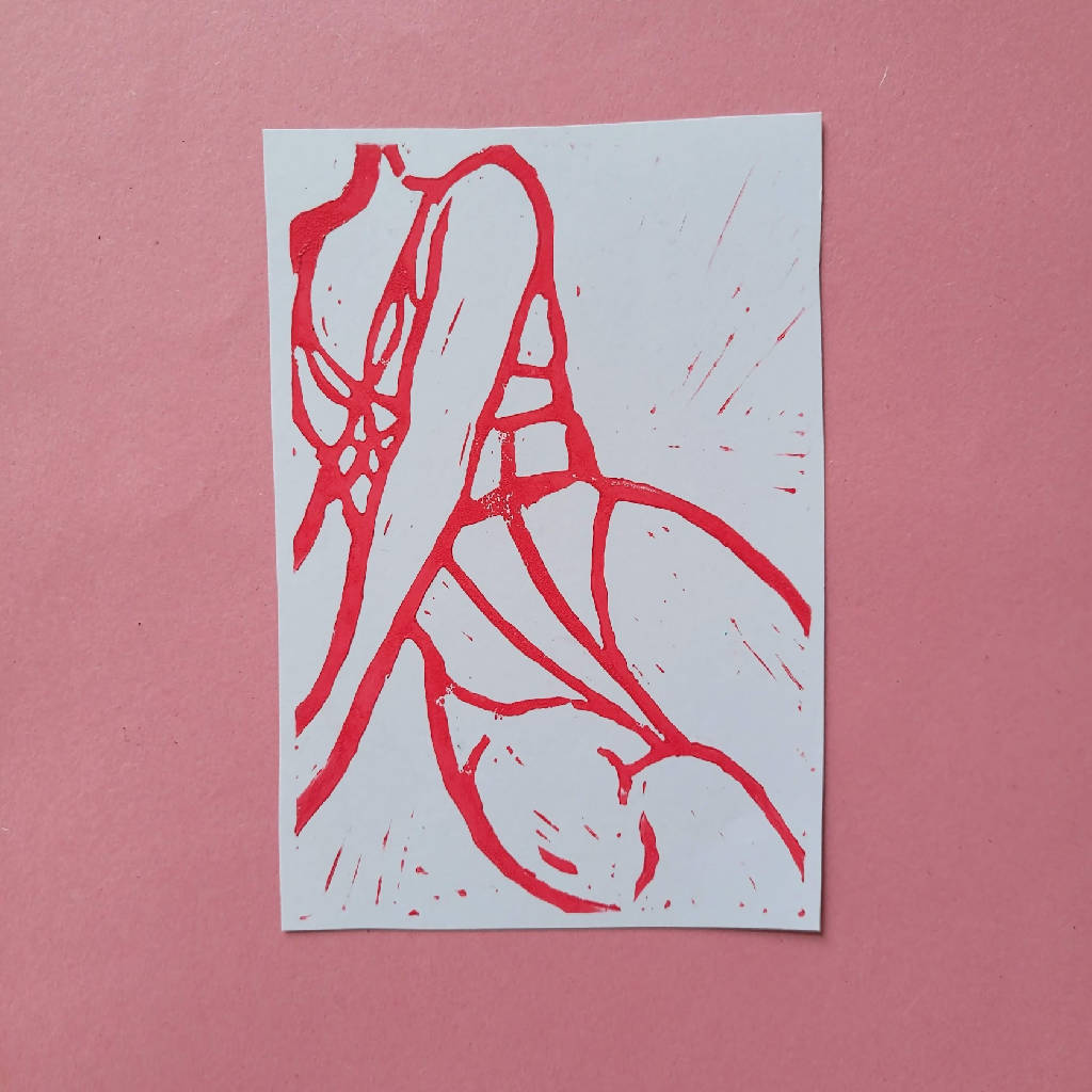 Seated female figure lino print