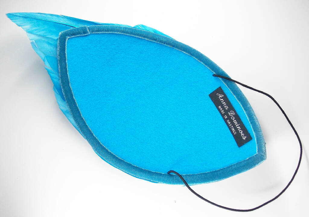 Turquoise feather wing fascinator