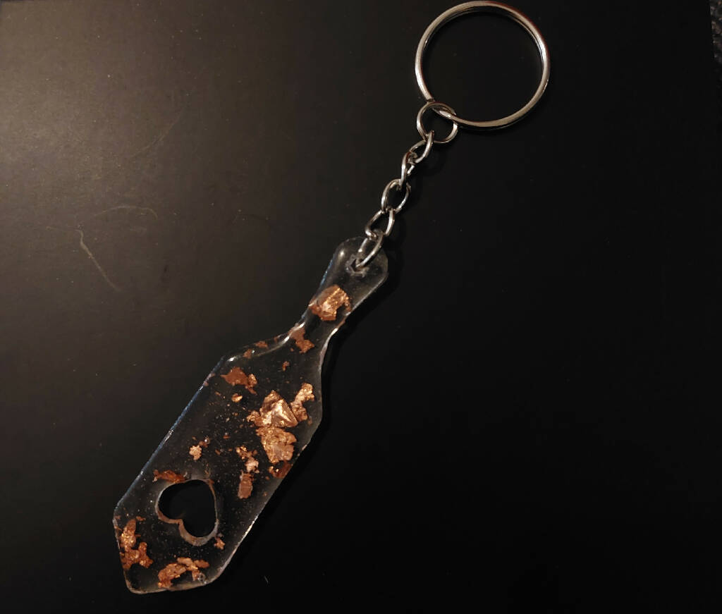 Pink glitter paddle shaped keychain, bondage keyring