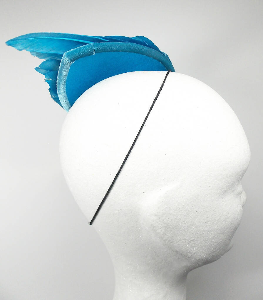 Turquoise feather wing fascinator