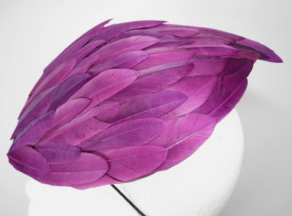 Purple feather wing fascinator