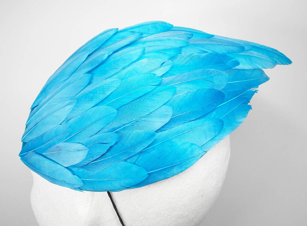 Turquoise feather wing fascinator