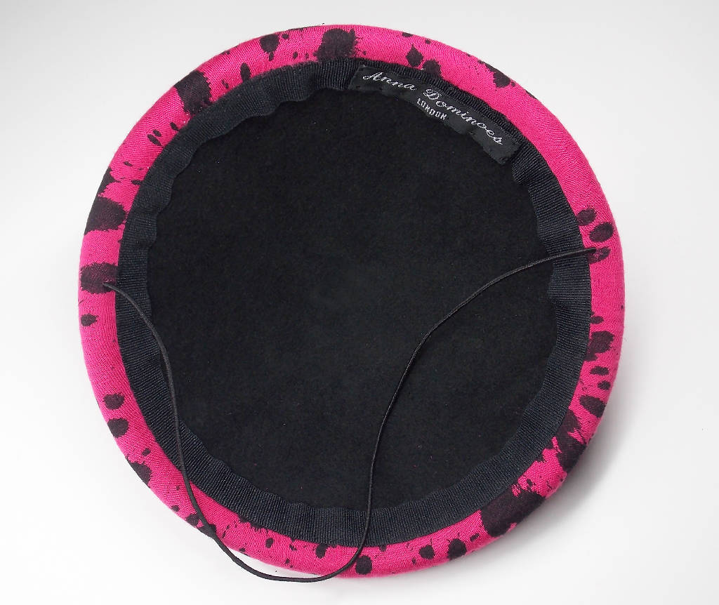 Pink mini hat with splatter design and spike