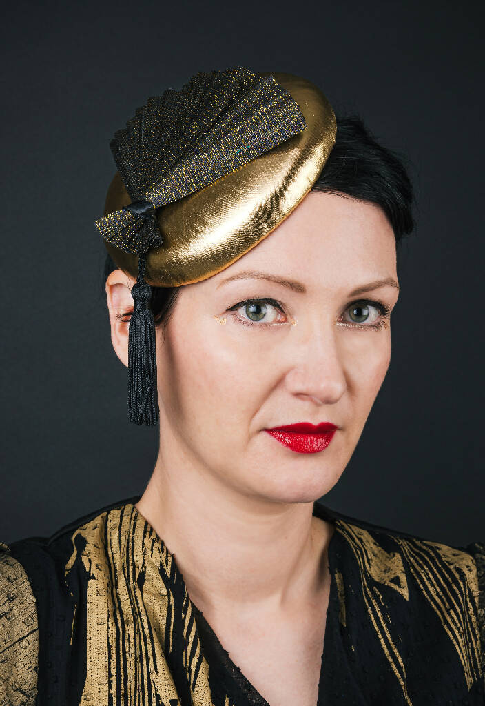 Gold fan mini hat modelled