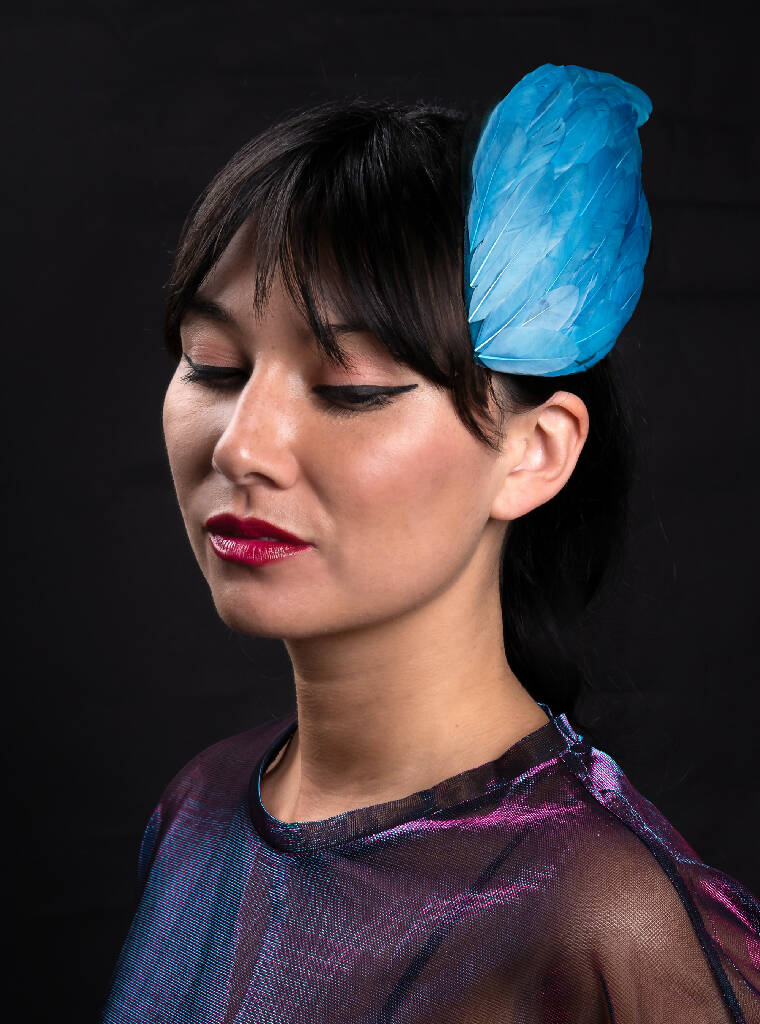 Turquoise feather wing fascinator